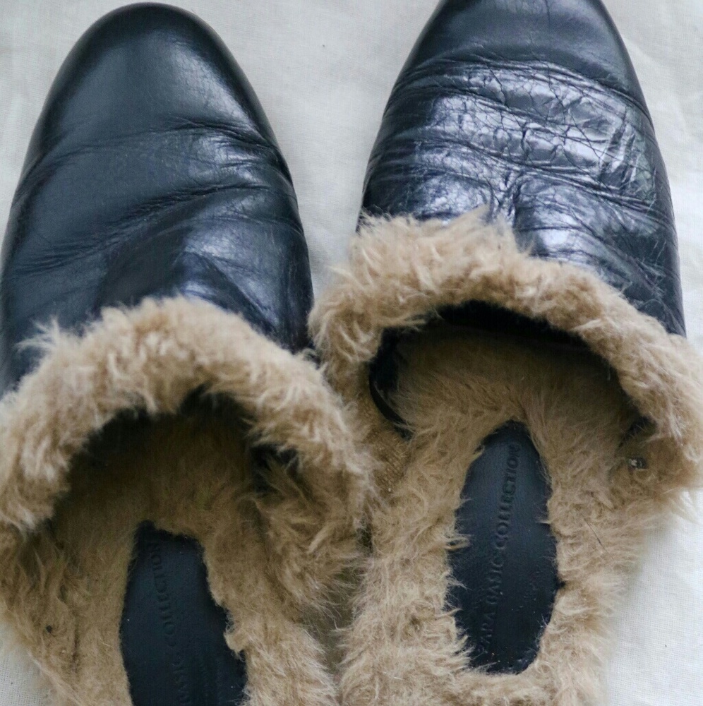 Black Zara leather slides.